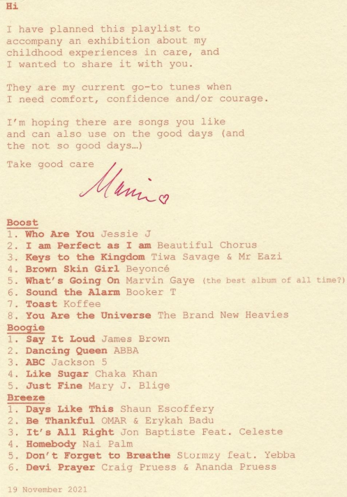 A light pink sheet of paper with red text in a type-writer-style font. Text reads: Hi, I have planned this playlist to accompany an exhibition about my childhood experiences in care, and I wanted to share it with you. They are my current go-to tunes when I need comfort, confidence and/or courage. I'm hoping there are songs you like and can also use on the good days (and the not so good days...) Take good care